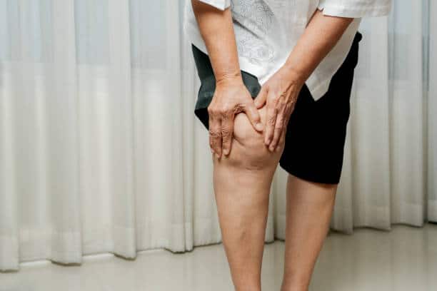 senior woman suffering from knee pain