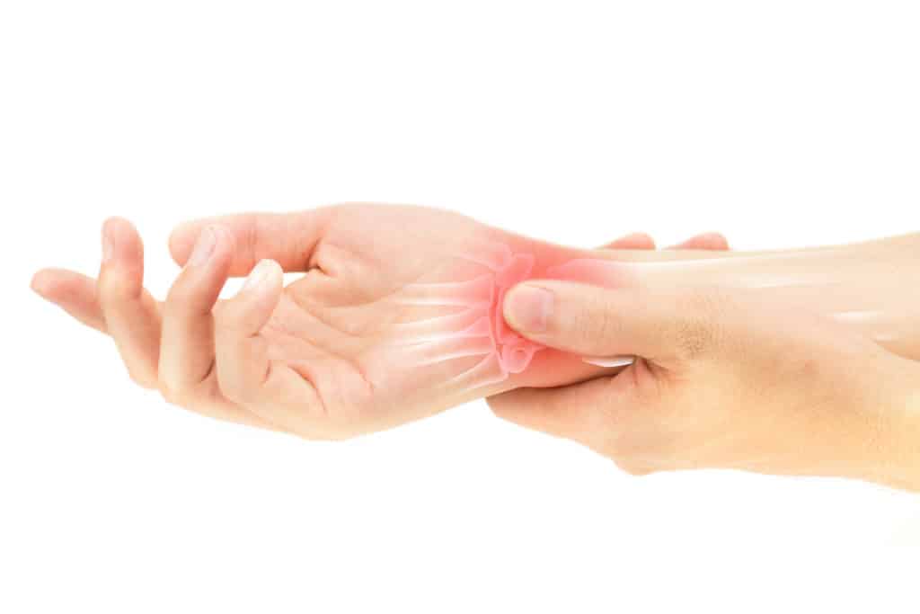 Hand pressing the wrist bone injury