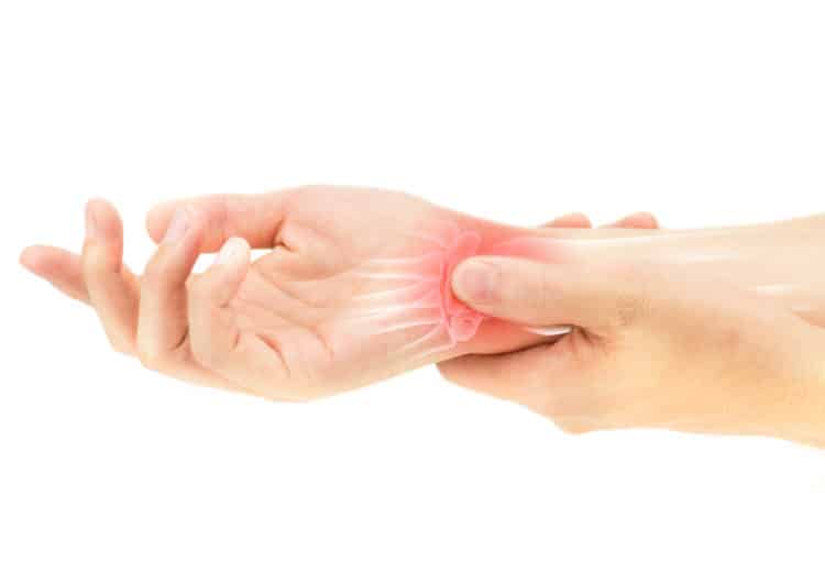 Hand pressing the wrist bone injury